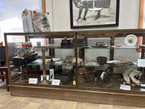 Display case at the archive containing many of the artifacts held at the archive. All photos for this article by the editor.