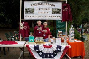 Board members John Schubert and Sarah Brooks staffing our booth at the 100th annual Monte Rio Variety Show in 2011.