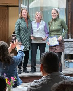 L-R Jane Barry, Kim Menary with Hanna Berkheimer, recipient of the 2023 John C. Schubert scholarship